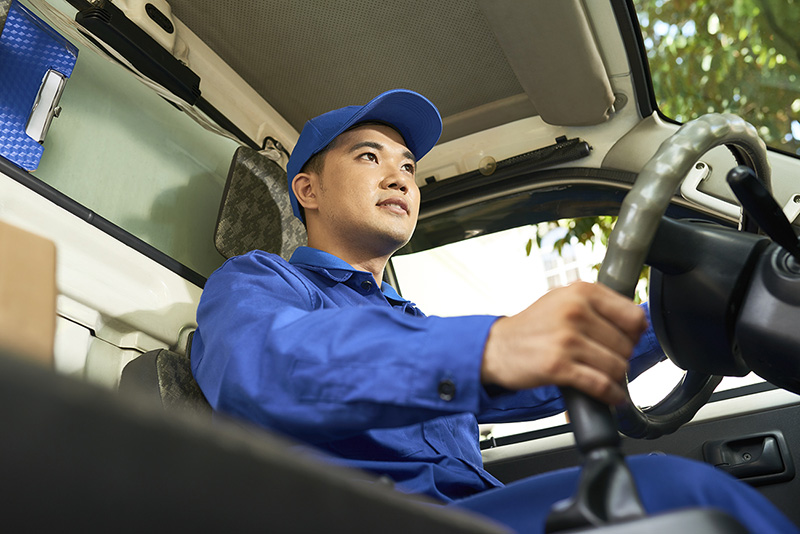 Delivery man driving van