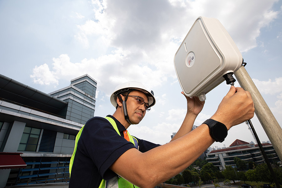 TM R&D worker installing FIRA Worker installing FIRA system