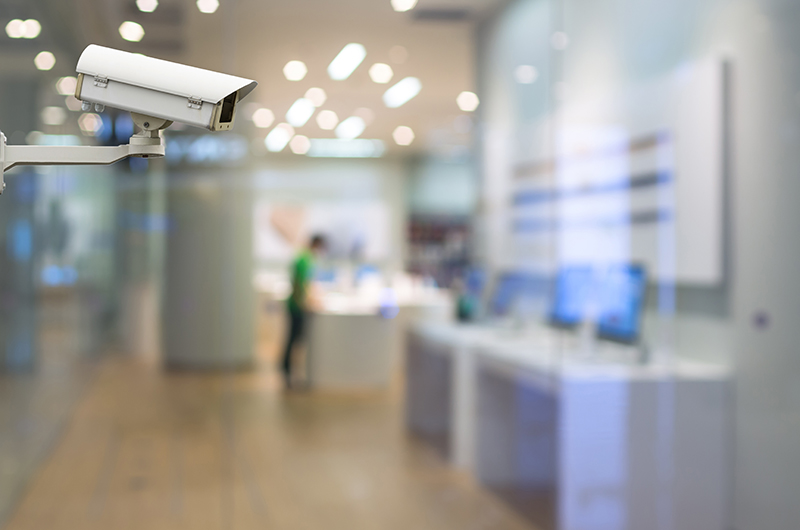 CCTV security camera on monitor the abstract store blurred in hall with bokeh background