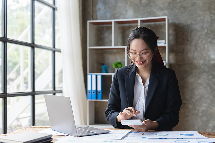 Asian woman accountant working with computer and calculator for business and financial expense. accounting bookkeeping concept