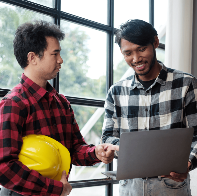 two-asian-engineers-discussing-construction-plans-2023-08-31-03-41-31-utc