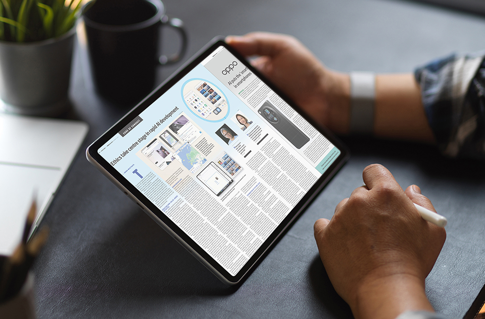 Side view of businessman using digital tablet with mock-up screen on dark working space